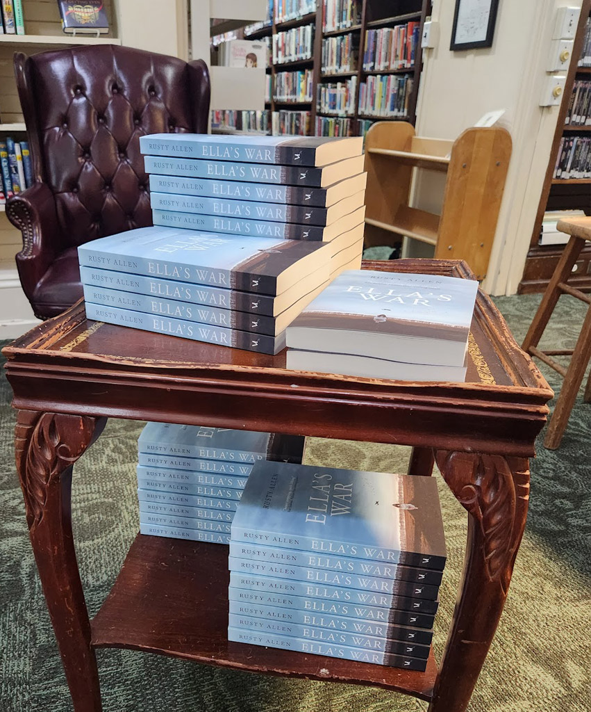 A stack of Ella's War books in a library.